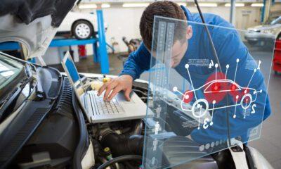 Car interface against mechanic using laptop on car